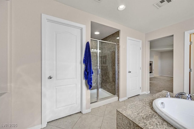 609 Doubleshot Ln, Henderson, NV 89052 - bathroom featuring a shower stall, tile patterned floors, a bath, and recessed lighting