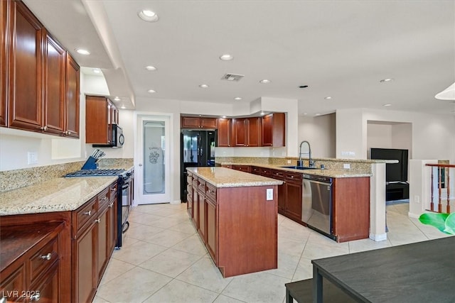 609 Doubleshot Ln, Henderson, NV 89052 - kitchen with black appliances, a peninsula, a kitchen island, light tile patterned flooring, and light stone counters
