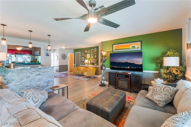 908 Bonita Ave, Las Vegas, NV 89104 - living room featuring ceiling fan and wood finished floors