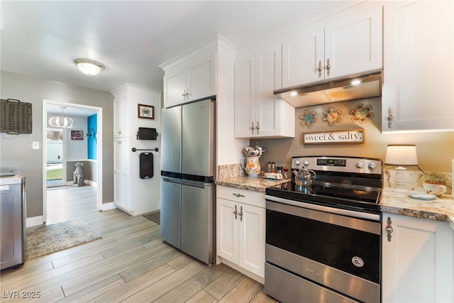 908 Bonita Ave, Las Vegas, NV 89104 - kitchen featuring appliances with stainless steel finishes, under cabinet range hood, light wood-style floors, white cabinetry, and light stone countertops