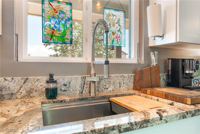 908 Bonita Ave, Las Vegas, NV 89104 - kitchen view of light stone countertops and white cabinets