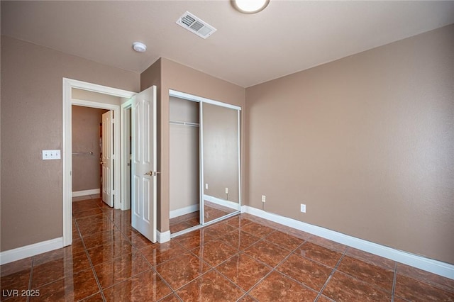 8708 Western Saddle Ave, Las Vegas, NV 89129 - unfurnished bedroom featuring a closet and baseboards