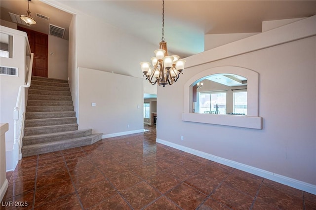 8708 Western Saddle Ave, Las Vegas, NV 89129 - spare room featuring a chandelier, stairway, and arched walkways