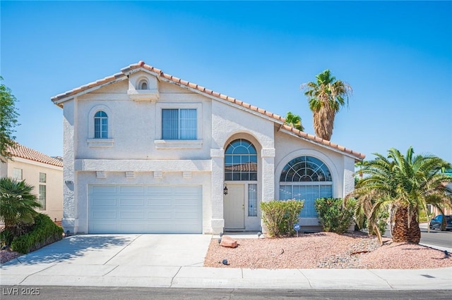 8708 Western Saddle Ave, Las Vegas, NV 89129 - mediterranean / spanish house with driveway, a tile roof, an attached garage, and stucco siding