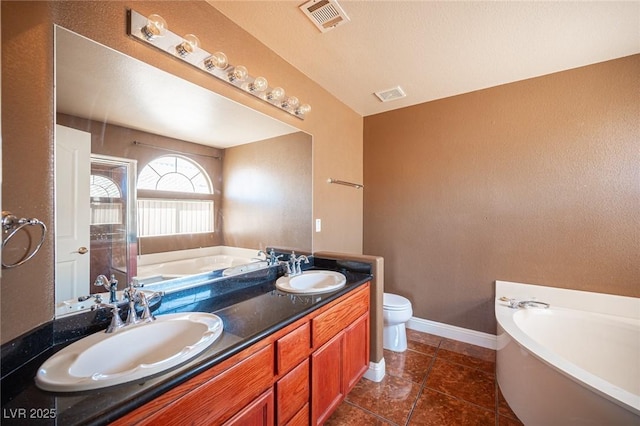 8708 Western Saddle Ave, Las Vegas, NV 89129 - full bath with a garden tub, double vanity, and tile patterned floors