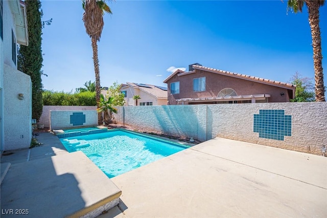 8708 Western Saddle Ave, Las Vegas, NV 89129 - view of swimming pool with a patio area, a fenced backyard, and a pool with connected hot tub
