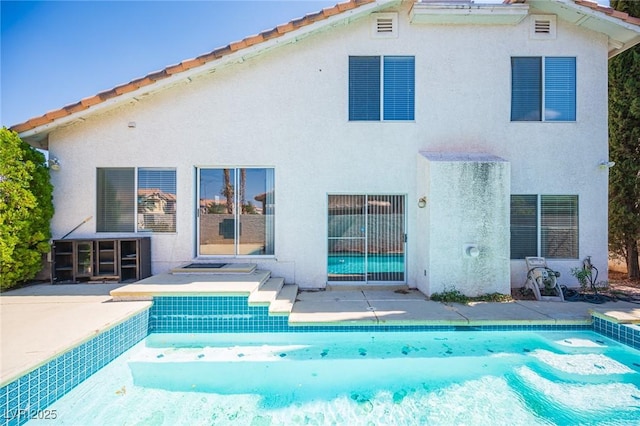 8708 Western Saddle Ave, Las Vegas, NV 89129 - rear view of house featuring stucco siding, an outdoor pool, a patio area, and a tiled roof