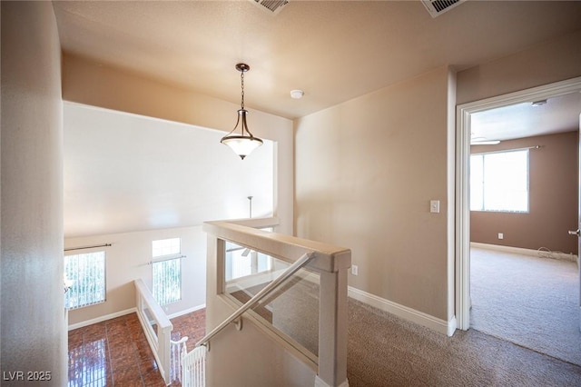 8708 Western Saddle Ave, Las Vegas, NV 89129 - corridor with an upstairs landing, healthy amount of natural light, and carpet flooring