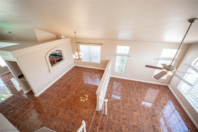 8708 Western Saddle Ave, Las Vegas, NV 89129 - unfurnished living room featuring a chandelier and ceiling fan