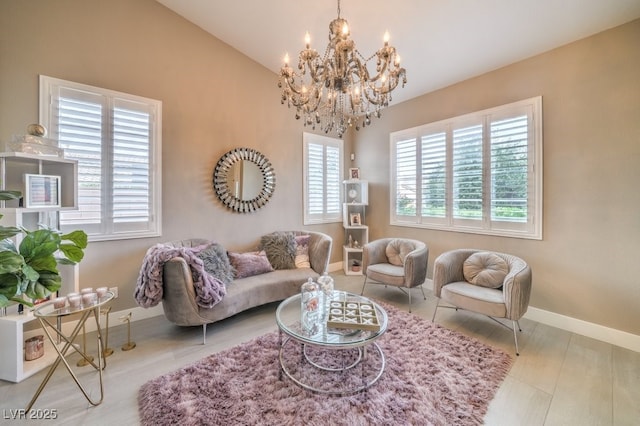 1131 Magic Meadow St, Henderson, NV 89052 - living room featuring a chandelier, lofted ceiling, and wood finished floors