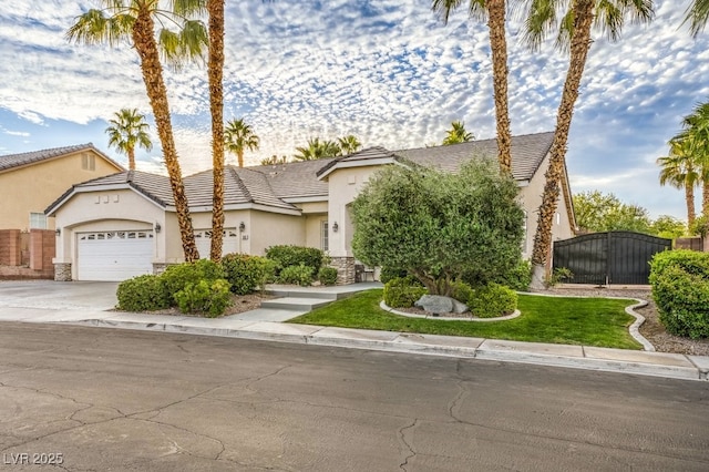 1131 Magic Meadow St, Henderson, NV 89052 - view of property hidden behind natural elements with stucco siding, stone siding, a garage, driveway, and a tiled roof