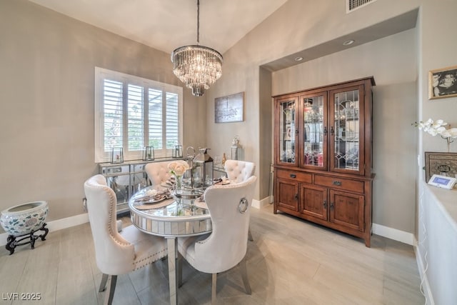1131 Magic Meadow St, Henderson, NV 89052 - dining area with a chandelier and high vaulted ceiling