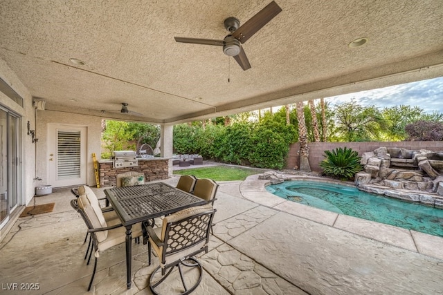 1131 Magic Meadow St, Henderson, NV 89052 - fenced backyard with an outdoor kitchen, outdoor dining space, a patio area, and ceiling fan