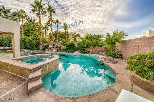 1131 Magic Meadow St, Henderson, NV 89052 - view of pool featuring a fenced backyard and a pool with connected hot tub