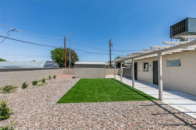 148 Fir St, Henderson, NV 89015 - fenced backyard with a shed and a patio area