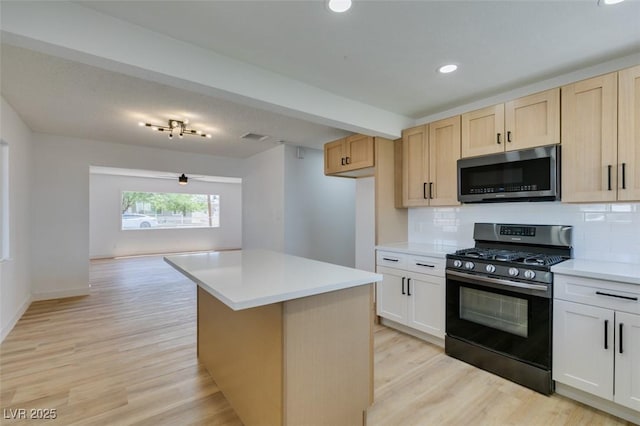 148 Fir St, Henderson, NV 89015 - kitchen with appliances with stainless steel finishes, light wood-type flooring, decorative backsplash, light countertops, and recessed lighting