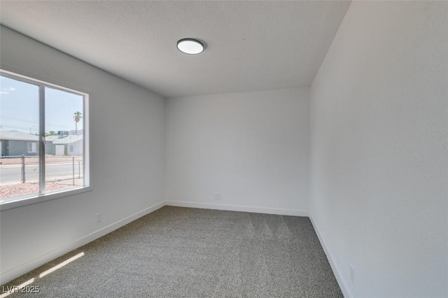 148 Fir St, Henderson, NV 89015 - carpeted spare room featuring baseboards and a textured ceiling