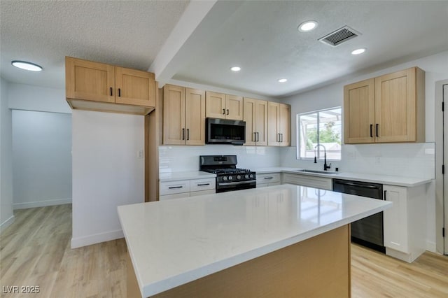 148 Fir St, Henderson, NV 89015 - kitchen featuring stainless steel appliances, tasteful backsplash, light wood finished floors, light brown cabinetry, and recessed lighting