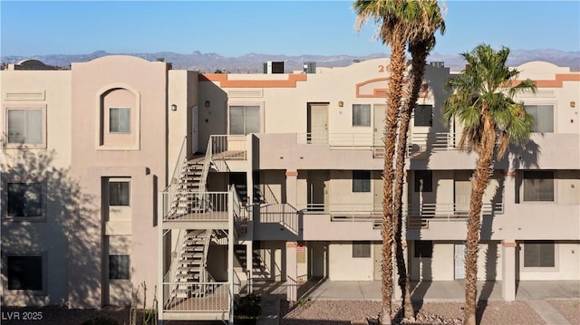2028 Mesquite Ln Unit 302, Laughlin, NV 89029 - view of building exterior with stairway and a mountain view