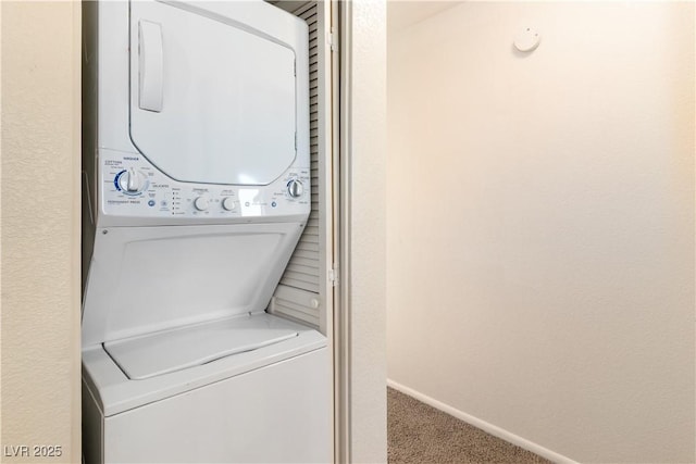 2028 Mesquite Ln Unit 302, Laughlin, NV 89029 - laundry room featuring stacked washer and clothes dryer and carpet flooring