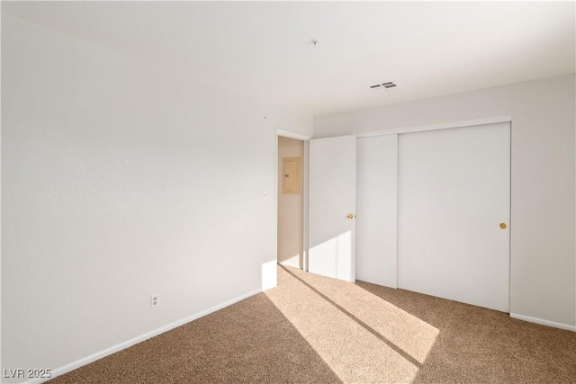 2028 Mesquite Ln Unit 302, Laughlin, NV 89029 - unfurnished bedroom featuring carpet flooring, a closet, and electric panel
