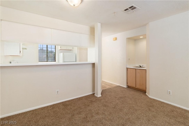 2028 Mesquite Ln Unit 302, Laughlin, NV 89029 - spare room featuring carpet floors and baseboards