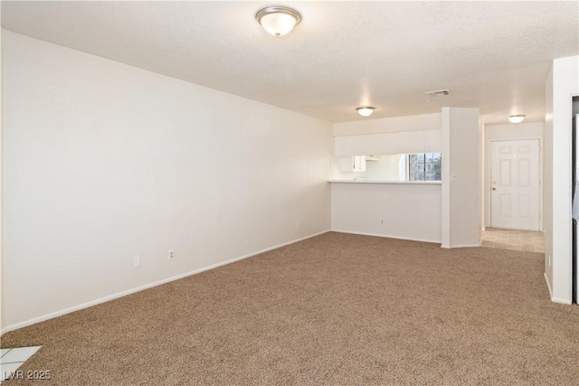 2028 Mesquite Ln Unit 302, Laughlin, NV 89029 - unfurnished living room featuring carpet floors and baseboards