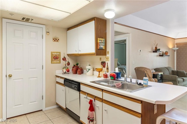3550 Bay Sands Dr Unit 3096, Laughlin, NV 89029 - kitchen featuring white dishwasher, a peninsula, light tile patterned flooring, light countertops, and white cabinets