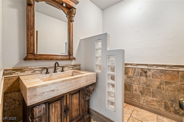 7154 Ranchito Cir, Las Vegas, NV 89120 - bathroom with stone tile flooring and vanity