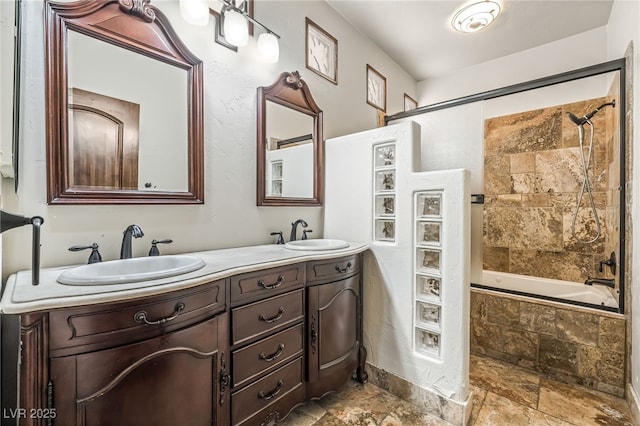 7154 Ranchito Cir, Las Vegas, NV 89120 - bathroom featuring tiled shower / bath combo, double vanity, and stone finish flooring