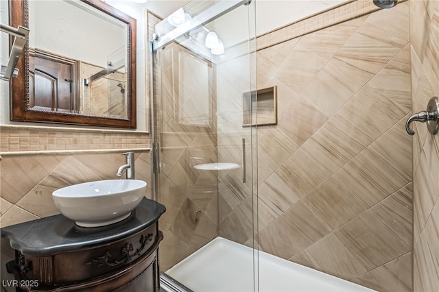 7154 Ranchito Cir, Las Vegas, NV 89120 - bathroom featuring tile walls, a stall shower, and vanity