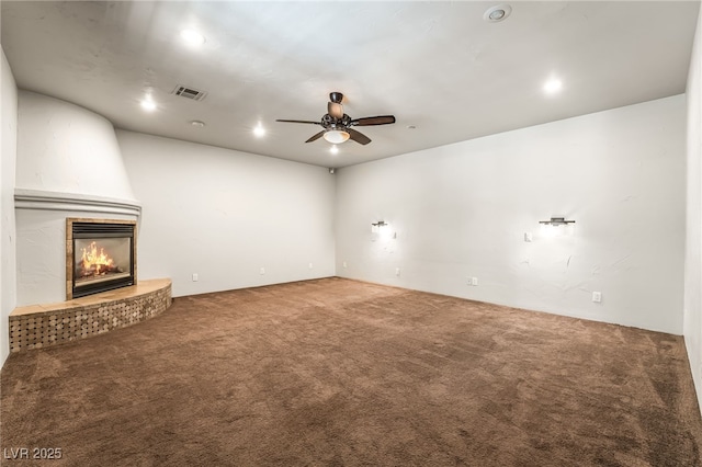 7154 Ranchito Cir, Las Vegas, NV 89120 - unfurnished living room with a fireplace, carpet, ceiling fan, and recessed lighting