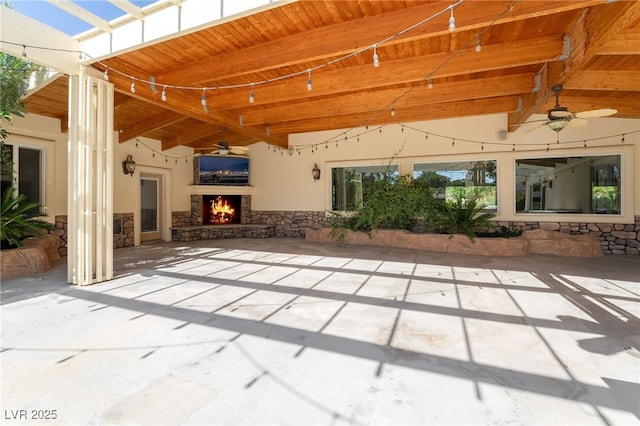7154 Ranchito Cir, Las Vegas, NV 89120 - view of patio featuring ceiling fan and an outdoor stone fireplace