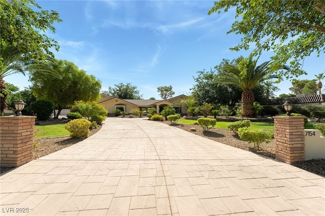 7154 Ranchito Cir, Las Vegas, NV 89120 - obstructed view of property featuring driveway