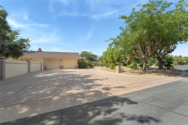 7154 Ranchito Cir, Las Vegas, NV 89120 - view of front of home featuring concrete driveway and an attached garage