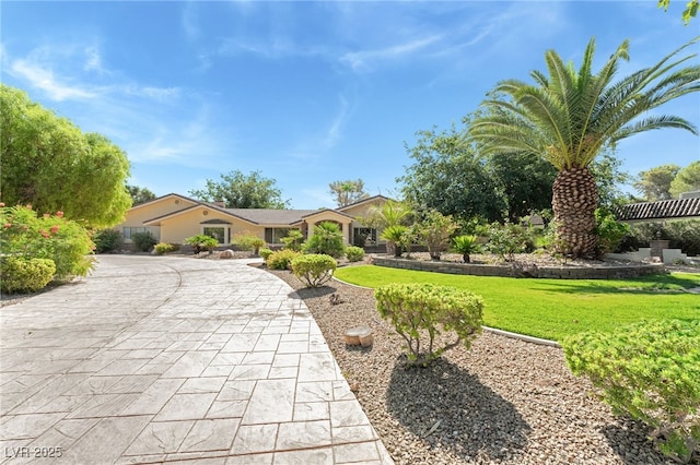 7154 Ranchito Cir, Las Vegas, NV 89120 - view of front of home with a front yard