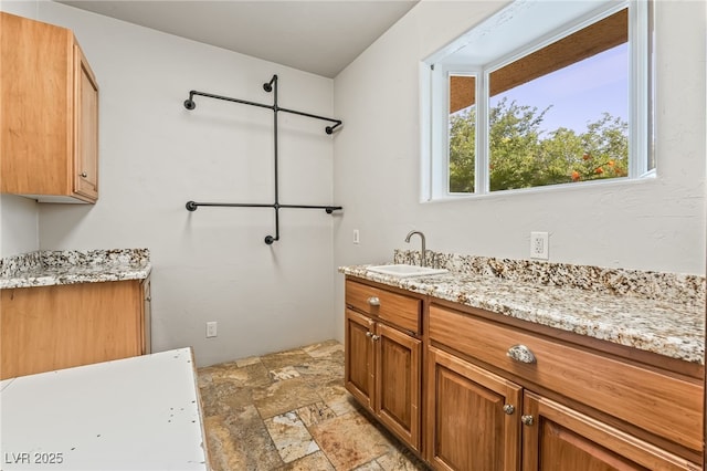 7154 Ranchito Cir, Las Vegas, NV 89120 - bathroom featuring stone finish floors and vanity