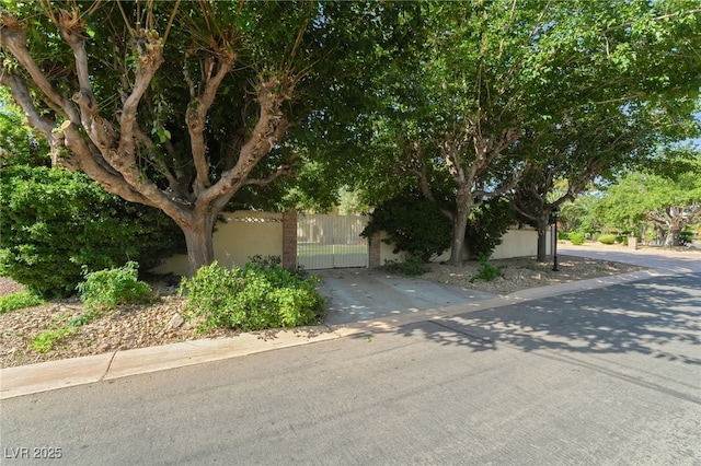 7154 Ranchito Cir, Las Vegas, NV 89120 - obstructed view of property with a gate and driveway