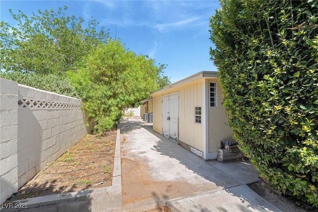 7154 Ranchito Cir, Las Vegas, NV 89120 - view of side of home featuring a fenced backyard and a patio area