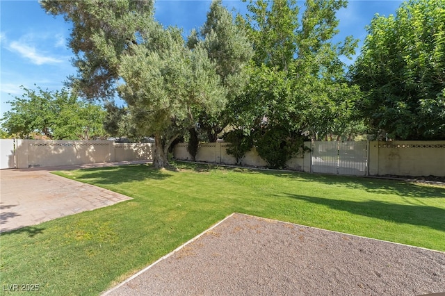 7154 Ranchito Cir, Las Vegas, NV 89120 - fenced backyard with a patio area and a gate