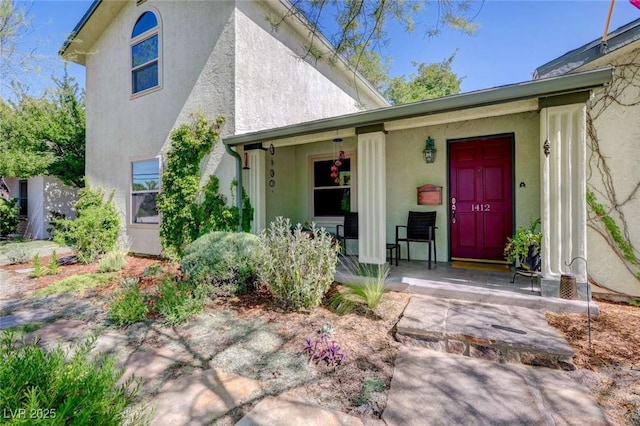 1412 5th St, Boulder City, NV 89005 - doorway to property with covered porch and stucco siding