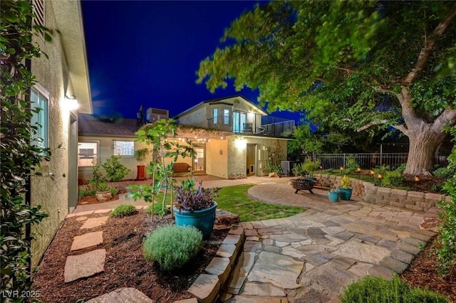 1412 5th St, Boulder City, NV 89005 - yard at twilight with a patio and a fire pit