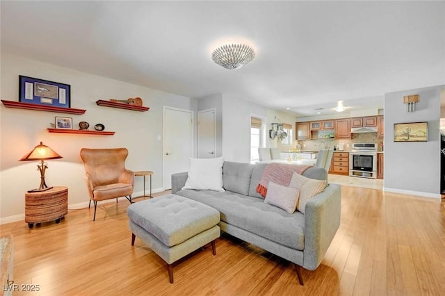 1412 5th St, Boulder City, NV 89005 - living room featuring light wood-style floors and baseboards