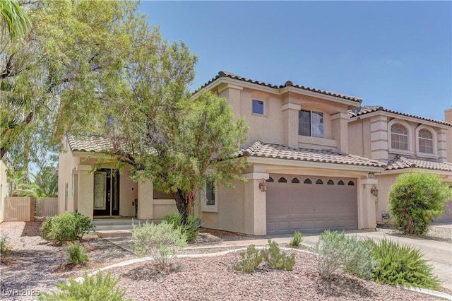 10978 Dornoch Castle St, Las Vegas, NV 89141 - mediterranean / spanish home with a tiled roof, stucco siding, and an attached garage