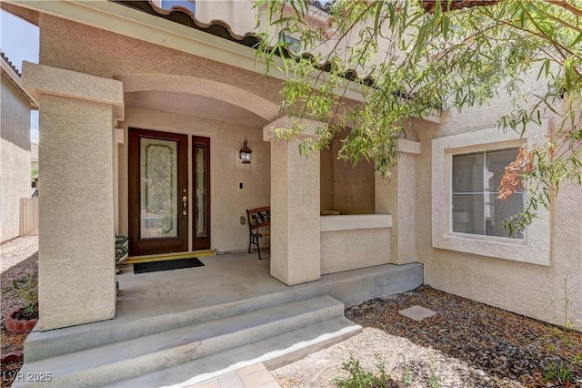10978 Dornoch Castle St, Las Vegas, NV 89141 - view of exterior entry featuring stucco siding and covered porch
