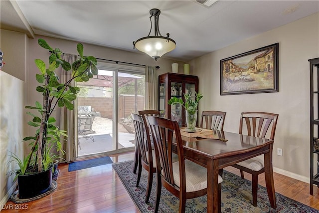 10978 Dornoch Castle St, Las Vegas, NV 89141 - dining space with wood finished floors and baseboards