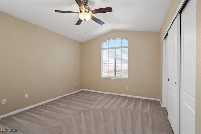 9794 Ice Box Canyon Ct, Las Vegas, NV 89117 - unfurnished bedroom with vaulted ceiling, a closet, carpet flooring, and a ceiling fan