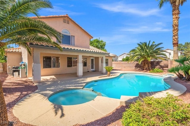 9794 Ice Box Canyon Ct, Las Vegas, NV 89117 - view of pool with a pool with connected hot tub, a fenced backyard, and a patio area