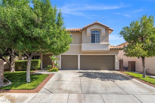 9794 Ice Box Canyon Ct, Las Vegas, NV 89117 - mediterranean / spanish home featuring a tiled roof, stucco siding, a garage, and driveway