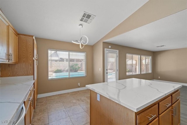 9794 Ice Box Canyon Ct, Las Vegas, NV 89117 - kitchen featuring a kitchen island, light stone counters, a chandelier, decorative light fixtures, and open floor plan